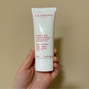 Clarins White Tube Moisture-Rich Body Lotion with Red Logo